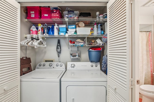 clothes washing area with washing machine and clothes dryer