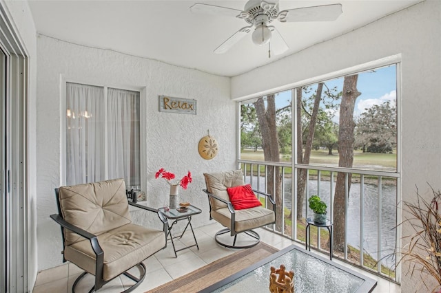 sunroom featuring ceiling fan