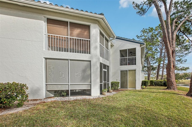 view of property exterior with a yard