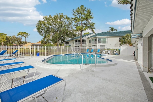 view of swimming pool featuring a patio area