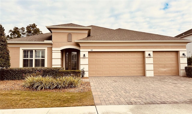 view of front of property with a garage