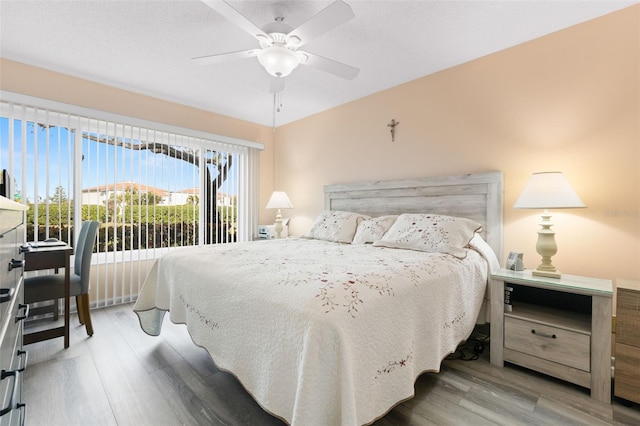 bedroom featuring hardwood / wood-style floors and ceiling fan