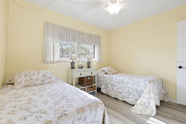 bedroom featuring hardwood / wood-style floors and ceiling fan