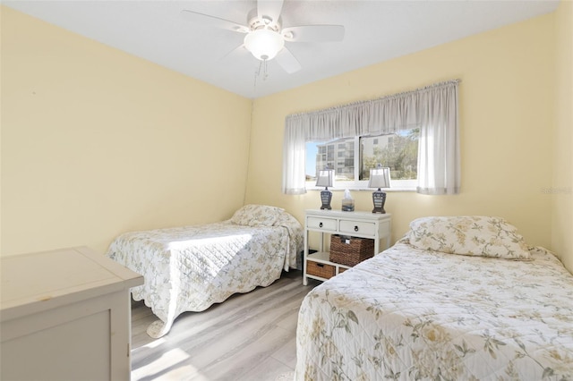 bedroom featuring ceiling fan and light wood-type flooring