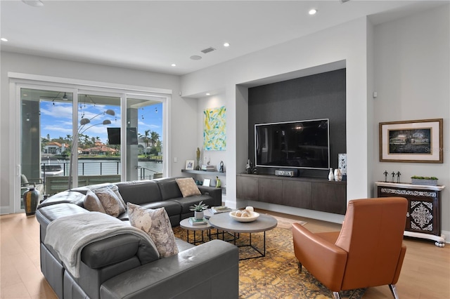 living room with light hardwood / wood-style flooring