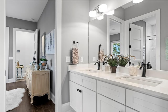 bathroom featuring hardwood / wood-style floors and vanity