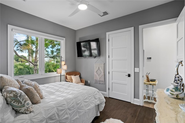 bedroom featuring ceiling fan and dark wood-type flooring