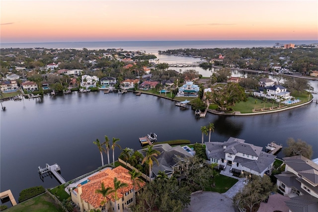 aerial view at dusk with a water view