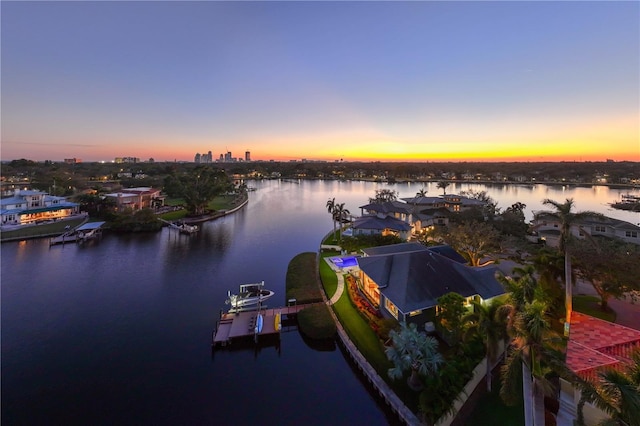 aerial view at dusk with a water view