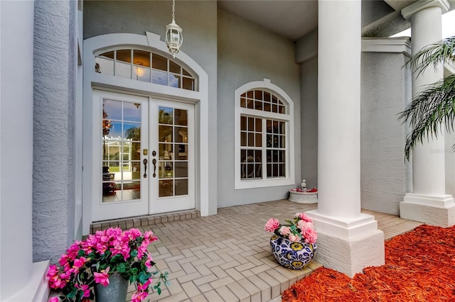 view of exterior entry featuring french doors