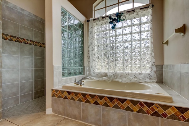 bathroom featuring tile patterned floors and shower with separate bathtub