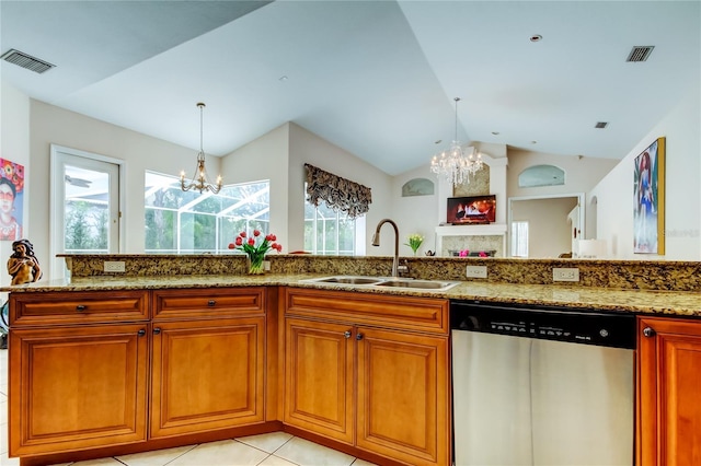 kitchen with vaulted ceiling, sink, light tile patterned floors, a notable chandelier, and dishwasher