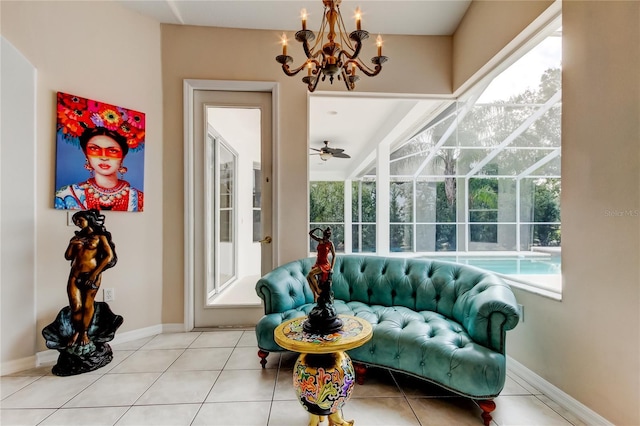 sunroom with ceiling fan with notable chandelier