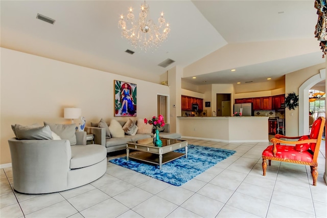 living room featuring light tile patterned floors, lofted ceiling, and a notable chandelier