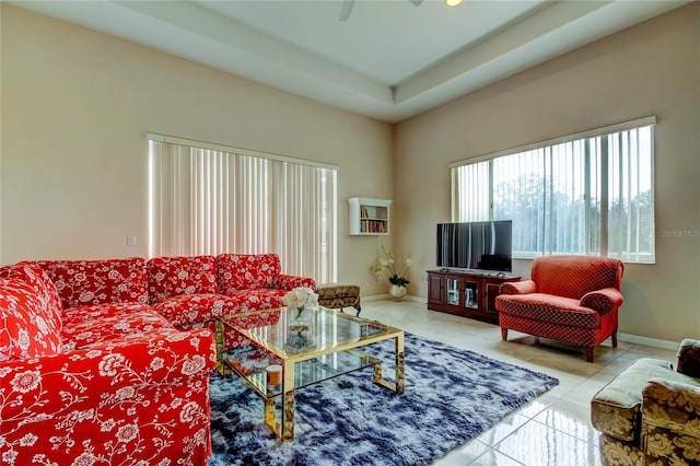 living room with tile patterned floors and ceiling fan