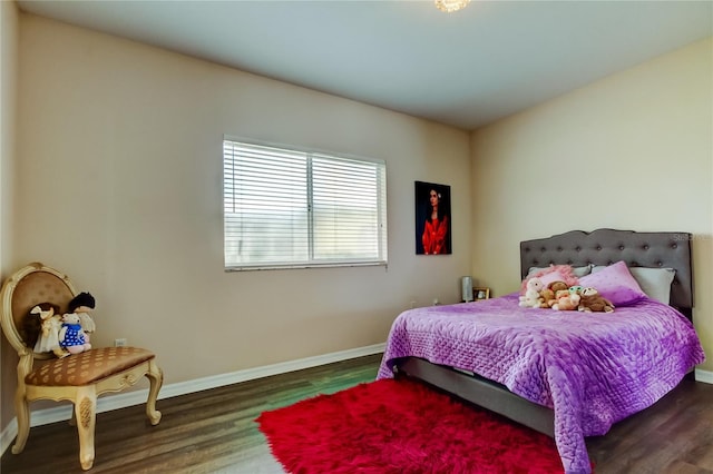 bedroom featuring dark hardwood / wood-style flooring