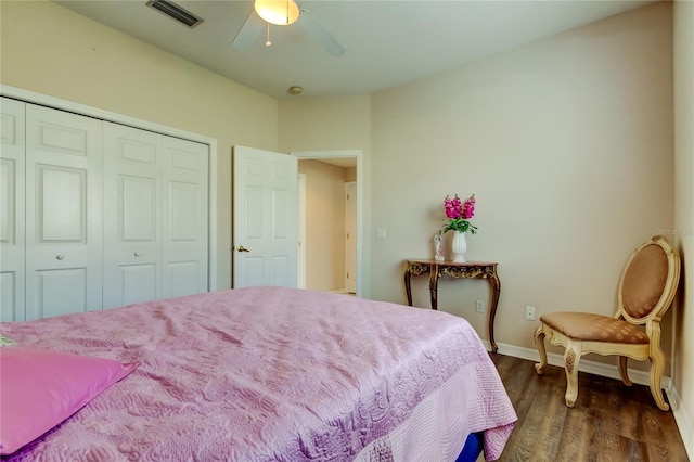 bedroom featuring a closet, ceiling fan, and dark wood-type flooring