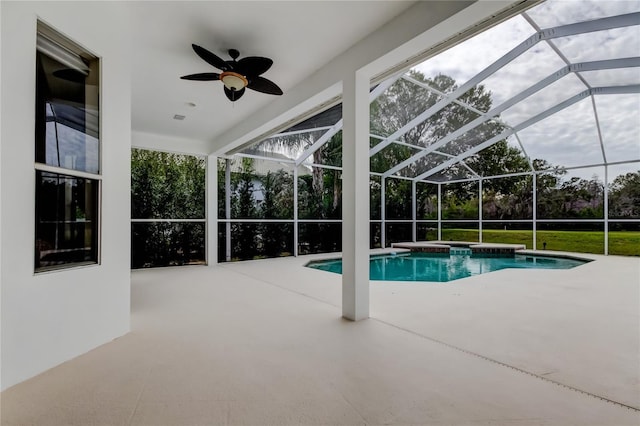 view of pool featuring ceiling fan, a lanai, and a patio