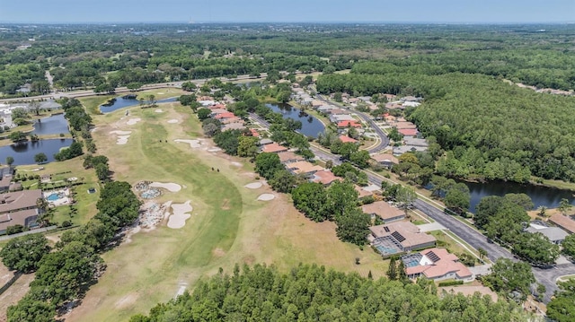 394 Tall Oak Trl, Tarpon Springs, FL 34688 - aerial view of property's location featuring a large body of water, nearby suburban area, a golf course, and a heavily wooded area