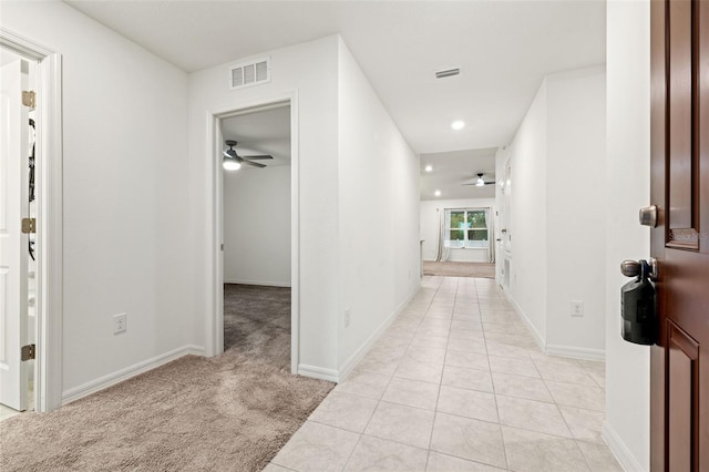 hallway with light carpet