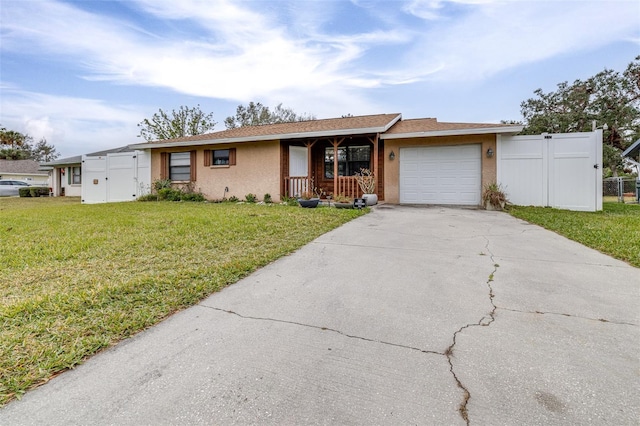 ranch-style house with a garage and a front lawn