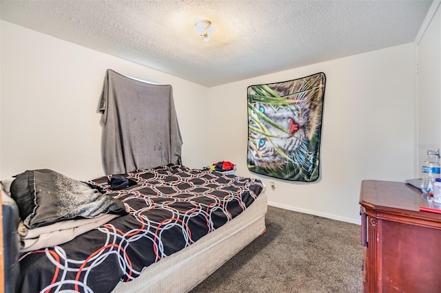 bedroom with carpet and a textured ceiling