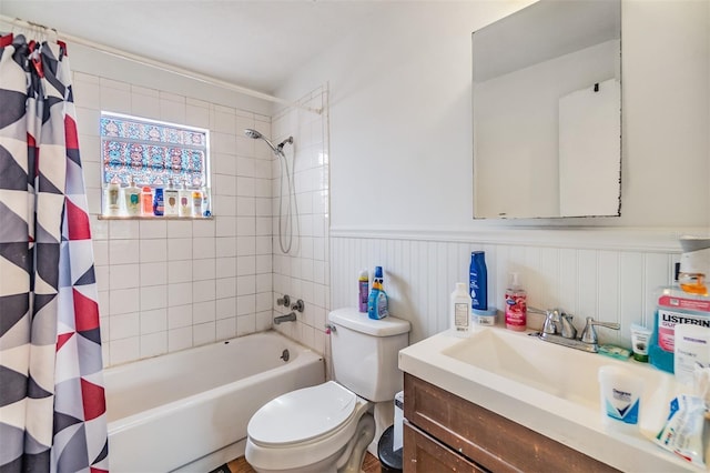 full bathroom with shower / bath combo, vanity, and toilet