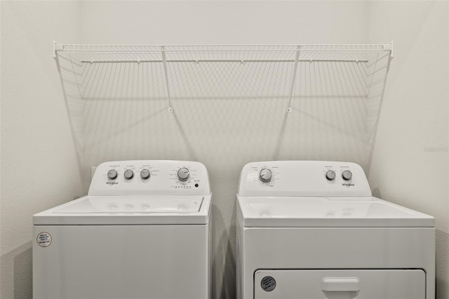 laundry room with washing machine and clothes dryer