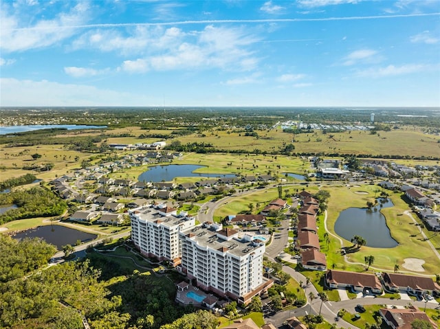 drone / aerial view featuring view of golf course and a water view