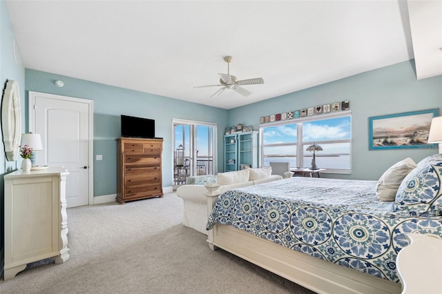 bedroom featuring ceiling fan, baseboards, and light colored carpet