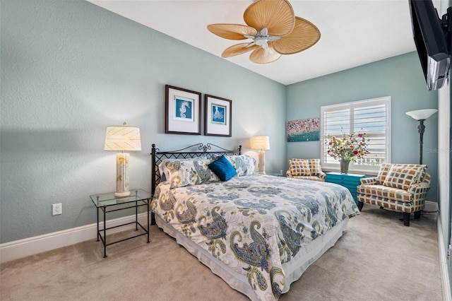 carpeted bedroom featuring ceiling fan and baseboards