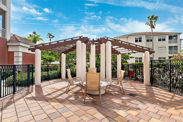 view of patio with fence and a pergola