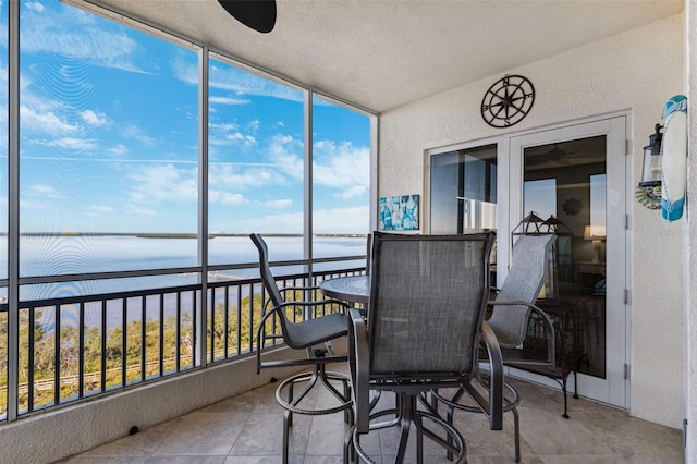 sunroom with a water view