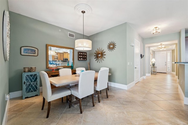 dining room featuring visible vents, baseboards, and light tile patterned floors