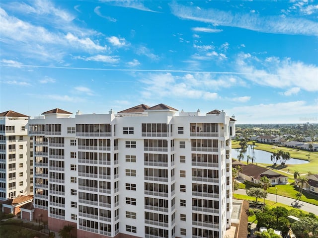 view of building exterior with a water view