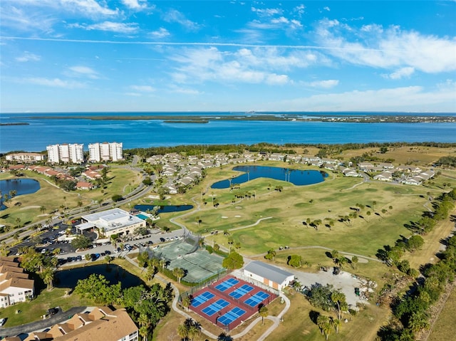 aerial view with golf course view and a water view