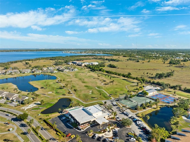 birds eye view of property featuring golf course view and a water view