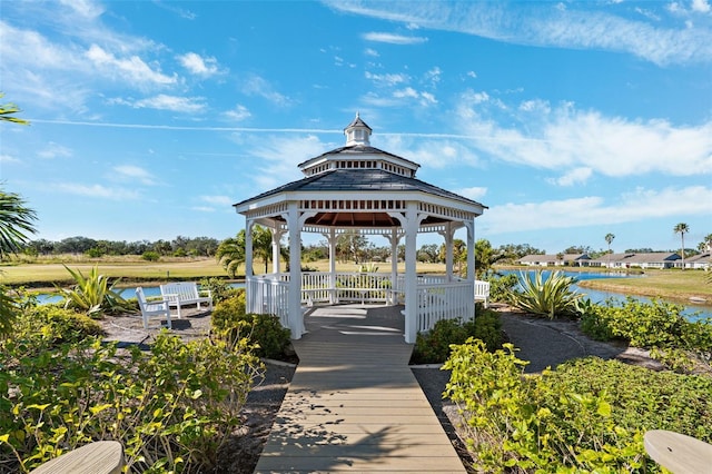 view of dock with a gazebo and a water view