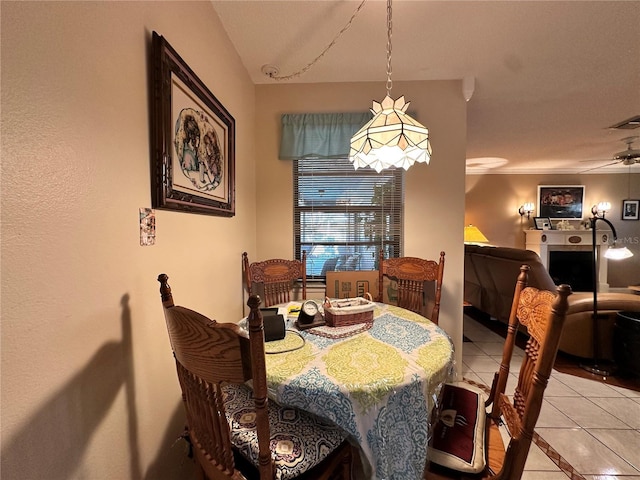 tiled dining area featuring ceiling fan