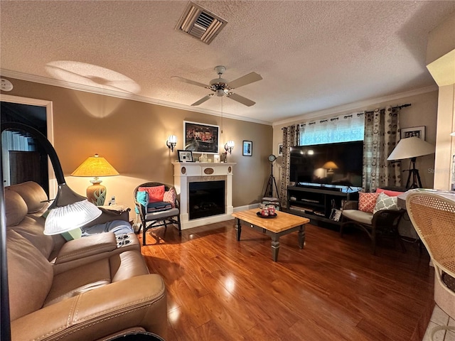 living room with a textured ceiling and ornamental molding