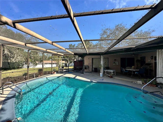 view of pool featuring a lanai and a patio area