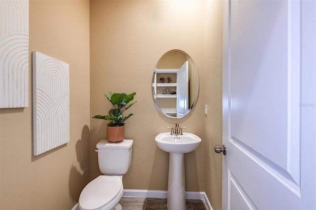 bathroom featuring toilet