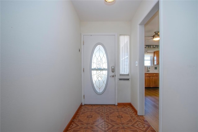 doorway to outside featuring sink