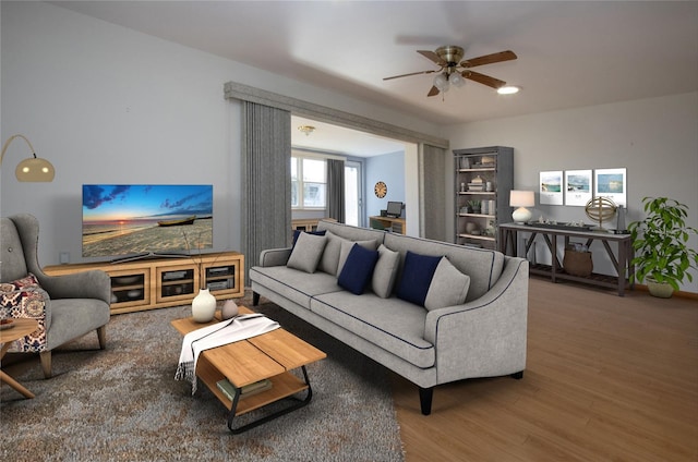 living room with ceiling fan and hardwood / wood-style floors