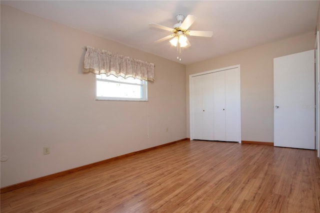 unfurnished bedroom with light hardwood / wood-style floors, a closet, and ceiling fan