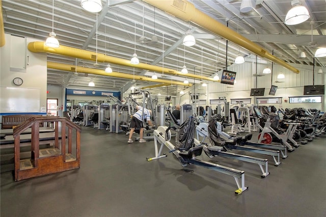 gym featuring a towering ceiling