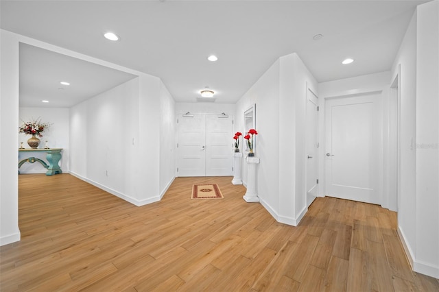 hall with light hardwood / wood-style floors