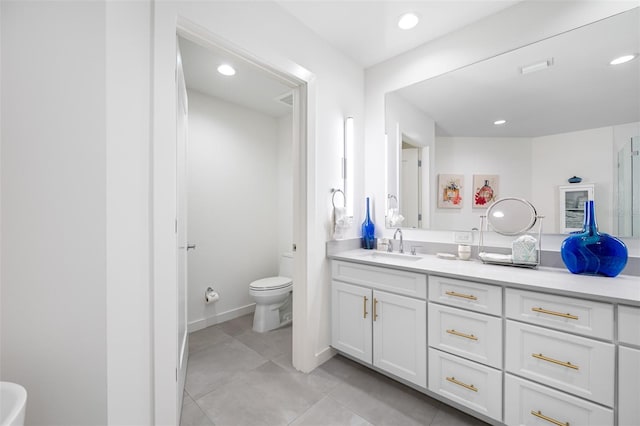 bathroom with tile patterned floors, toilet, and vanity