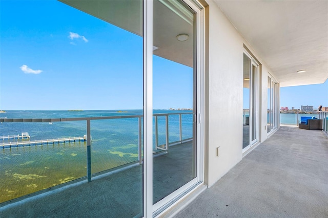 balcony featuring a water view