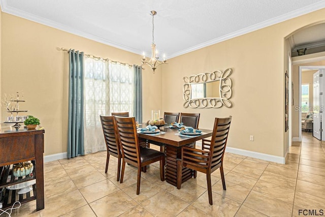 tiled dining area with crown molding and a chandelier